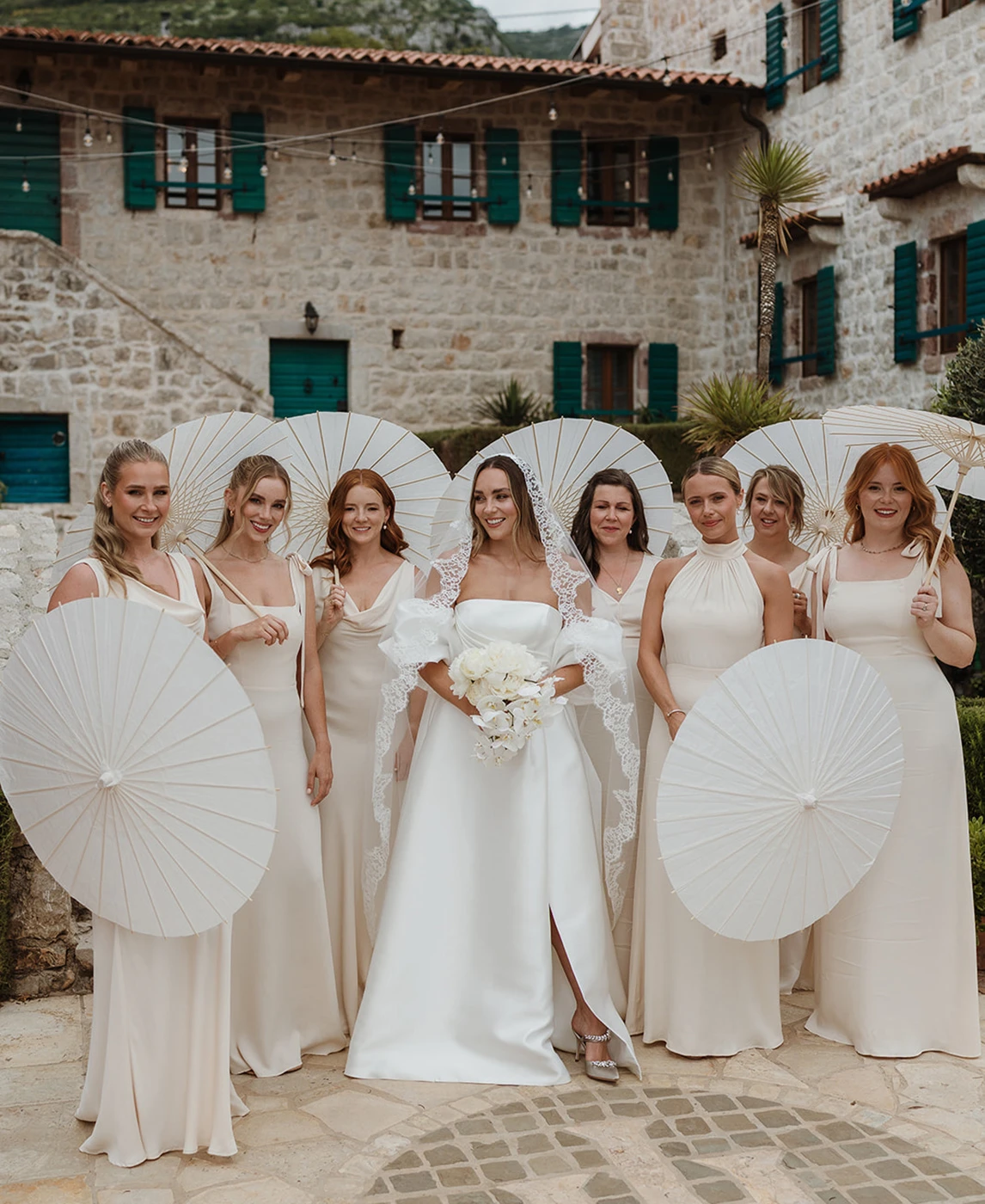Flottie wedding decor and organisation: joyful garden wedding moments featuring the bride with bridesmaids holding parasols, a couple walking through confetti, and a champagne tower for the A Garden Vow project