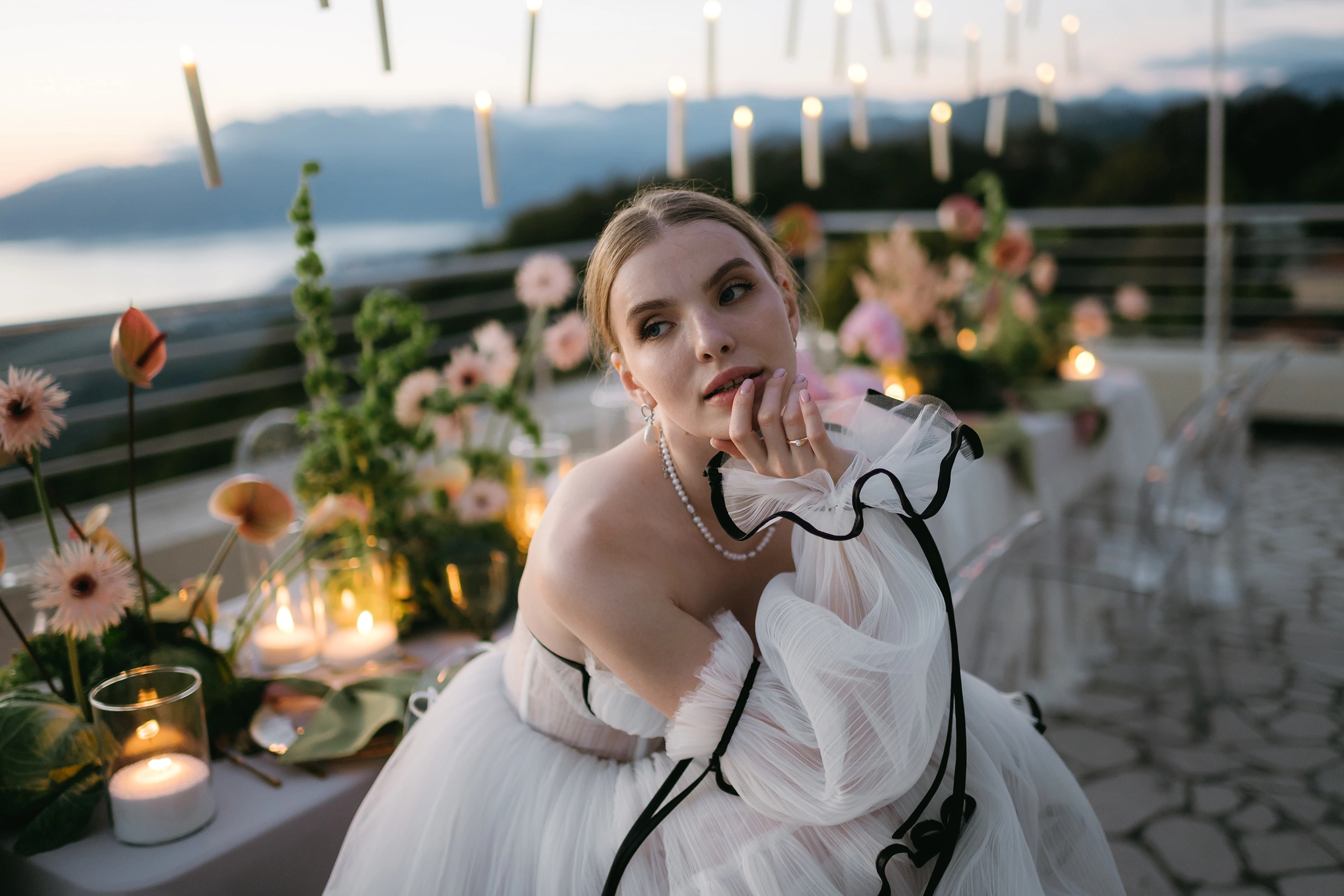 Flottie wedding decor and organisation: elegant bride in a tulle dress at an evening candlelit reception table featuring creative cabbage and floral styling for The Cabbage Affair project